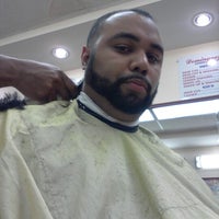 Photo taken at Dominguez Barbershop by Julio R. on 8/16/2012