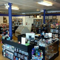 Photo taken at Comix Revolution by Anthony G. on 2/5/2012
