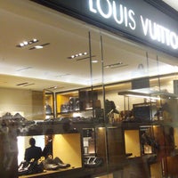 Photo taken at Louis Vuitton by Karina S. on 1/4/2012