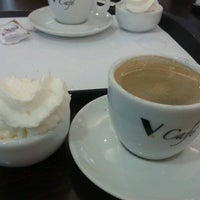 Photo taken at Viena Café by Marcos R. on 2/9/2012