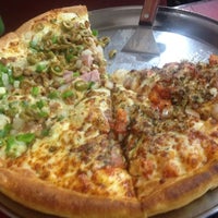 Photo taken at Super Pizza Pan by Anderson J. on 7/28/2012