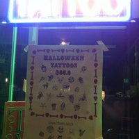Photo taken at Tattoos Deluxe by Shellz M. on 10/12/2011