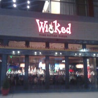 Photo taken at Wicked Restaurant and Wine Bar by Kim S. on 6/10/2012