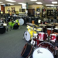 Photo taken at Percussion Center Drums by Kate W. on 6/15/2012