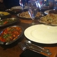 Photo taken at Saffron Indian Cuisine by Sarah L. on 3/16/2011