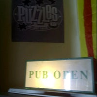 Photo taken at Puzzles Pub by Guillermo G. on 1/6/2012