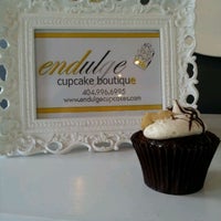 Photo taken at Endulge Cupcake Boutique by Justin D. on 3/28/2012