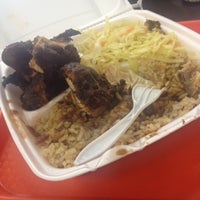 Photo taken at Golden Krust Caribbean Bakery and Grill by Amber on 9/1/2012
