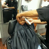 Photo taken at Prime Time Styles &amp;amp; Cuts (formerly The Ultimate Barbershop) by Heather G. on 4/25/2012