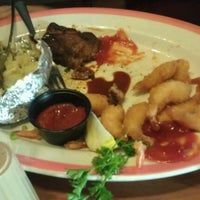 Photo taken at Sizzler by Rogaciano E. on 5/21/2012