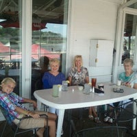 Photo taken at Rick&amp;#39;s Cafe Boatyard by Chad P. on 8/9/2012