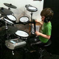 Photo taken at Chops Percussion by Amanda M. on 3/14/2012