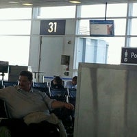 Photo taken at Gate C31 by Michelle L. on 4/4/2012