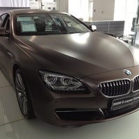 Photo taken at BMW Барс by Alexander U. on 7/24/2012