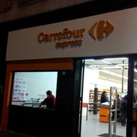 Photo taken at Carrefour Express by Andrés P. on 6/29/2012