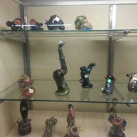 Photo taken at Dragon&amp;#39;s Den Smoke Shop by Andres O. on 7/25/2012