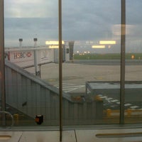Photo taken at Gate 61 by Xavier T. on 7/9/2012