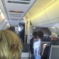 Photo taken at Gate A19 by Tiago C. on 3/23/2012