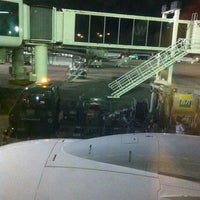 Photo taken at Gate 23 by Cristiano S. on 5/22/2012