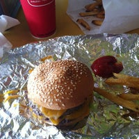 Photo taken at MOOYAH Burgers, Fries &amp;amp; Shakes by Montana D. on 4/9/2012