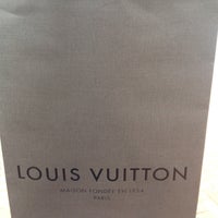 Photo taken at Louis Vuitton by Richard T. on 9/2/2012