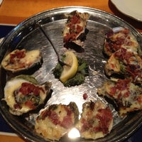 Photo taken at Aw Shucks Oyster Bar &amp;amp; Arcade by Larry J. on 5/25/2012