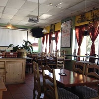 Photo taken at El Asador Restaurante Nicaraguense by Alex P. on 7/28/2012