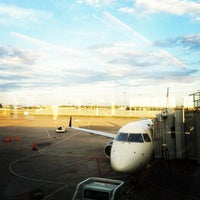 Photo taken at Gate 23 by Yifei Y. on 8/26/2012