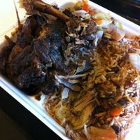 Photo taken at Jerk Hut Jamaican Grille by Wally S. on 3/15/2012