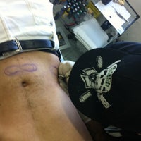 Photo taken at Industrial Piercing by Carlos S. on 5/14/2012