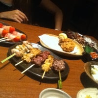 Photo taken at 炭火焼だいにんぐ わたみん家 藤沢南口店 by Chihiro O. on 8/26/2012