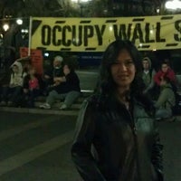 Photo taken at Occupy Wall Street by Jnette B. on 3/25/2012