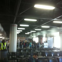Photo taken at Gate D4 by Charly S. on 3/9/2012
