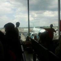 Photo taken at Gate D55 by Jeanne F. on 6/30/2012