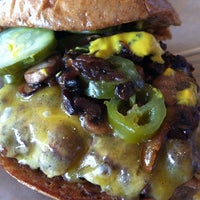 Photo taken at Juicy Burgers &amp;amp; Dogs by R L. on 4/17/2012