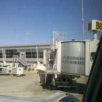 Photo taken at Gate B8 by Christopher D. on 4/9/2012