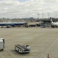Photo taken at Gate 30 by Eric G. on 3/1/2012