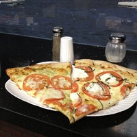 Photo taken at Slices Pizza by Antonino N. on 3/12/2012