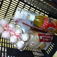 Photo taken at Lawson Store 100 by Munetoshi T. on 7/25/2012