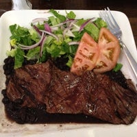 Photo taken at Parrilla Steakhouse by Marie D. on 3/20/2012