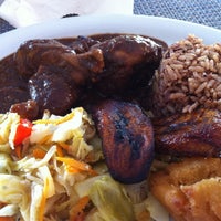 Photo taken at Ackee Bamboo Jamaican Cuisine by Aminah C. on 8/9/2012