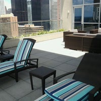Photo taken at Hilton Of Americana Pool Roof Top by Reginald C. on 5/1/2012