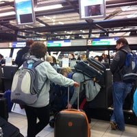 Photo taken at Check-in Row 26 by Nathalie S. on 3/17/2012