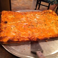 Photo taken at Basilicos Pizzeria by Michelle R. on 8/10/2012