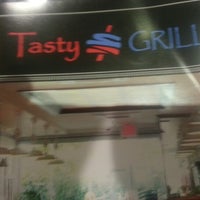Photo taken at Tasty Grill by Victor B. on 7/25/2012