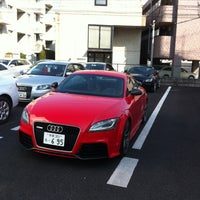 Photo taken at Audi調布 by Ide D. on 2/10/2012