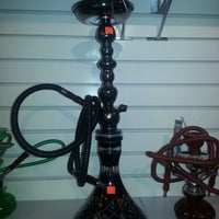 Photo taken at Dragon&amp;#39;s Den Smoke Shop by Andres O. on 8/1/2012