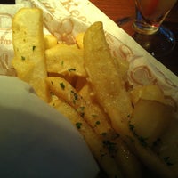 Photo taken at Red Robin Gourmet Burgers and Brews by Teddy O. on 3/25/2012