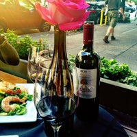 Photo taken at Wine &amp;amp; Roses Wine Bar &amp;amp; Cafe by Kate C. on 8/22/2012