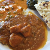Photo taken at Azad Indian Restaurant by Stephanie S. on 8/1/2012